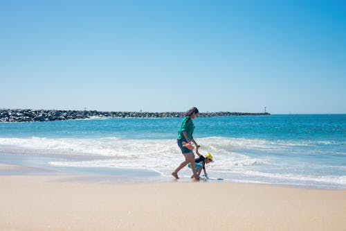 A Boy and His Mother at the Beach