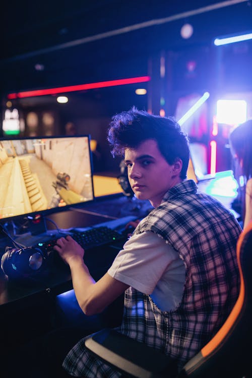 A Boy Playing on a Computer