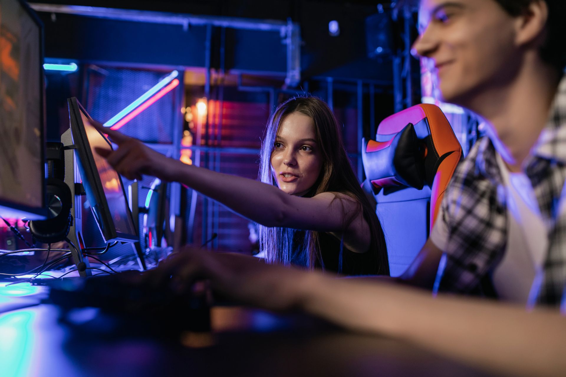 A Girl Pointing on a Monitor