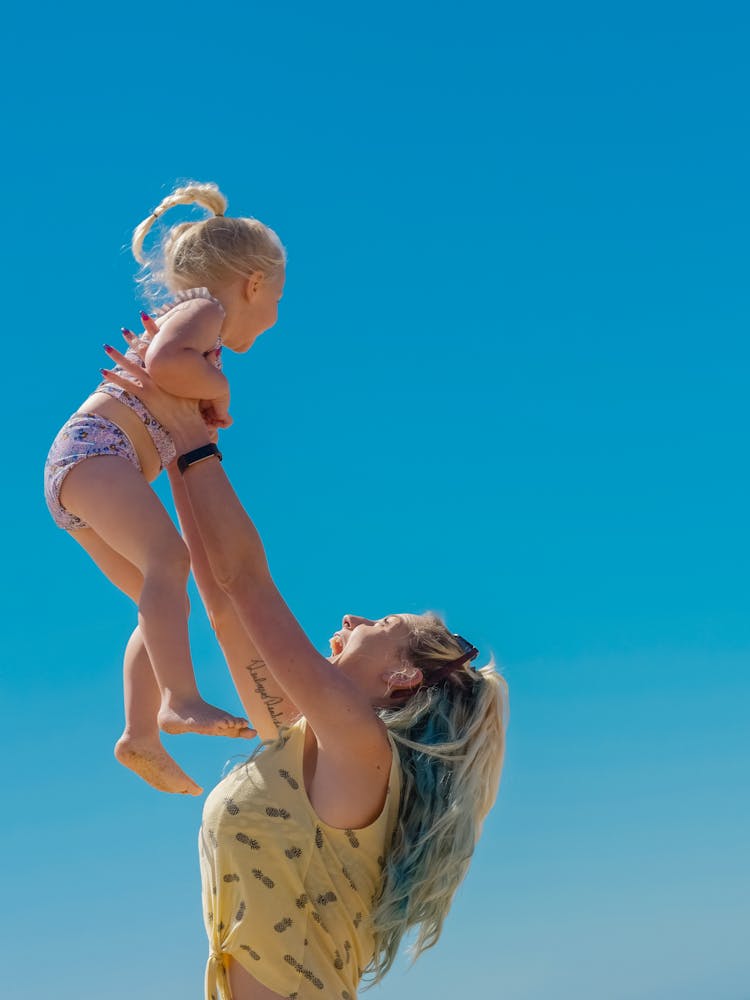 A Mother Carrying Her Daughter