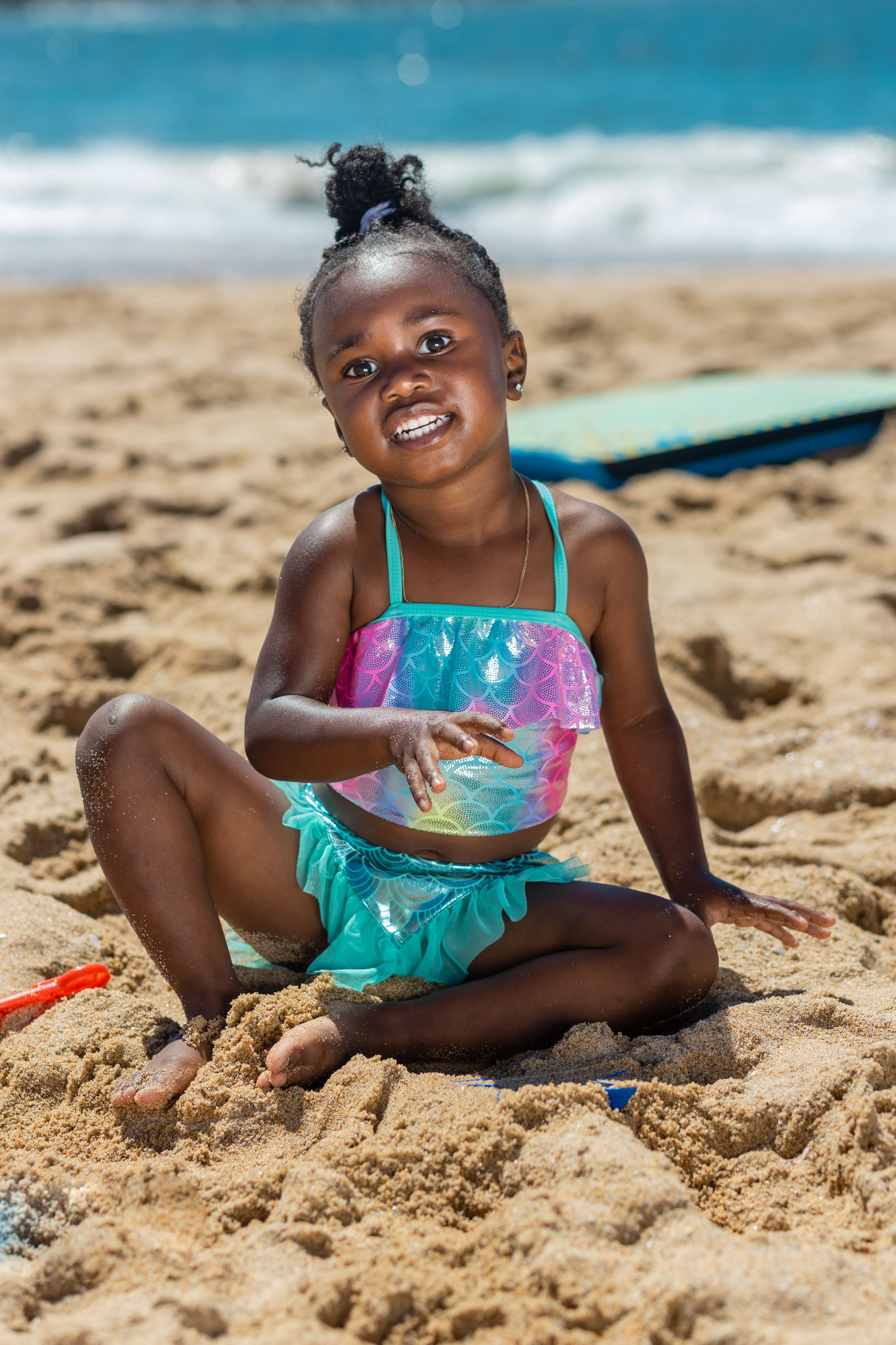 Girl in Teal Bikini Sitting on Beach Sand · Free Stock Photo
