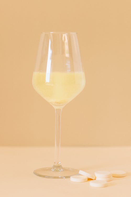 A Glass with Yellow Liquid