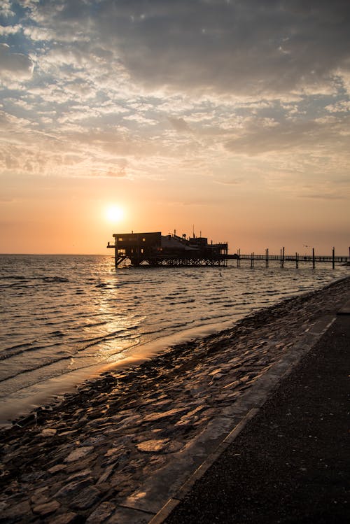 Free stock photo of beach sunset, clouds, jetty