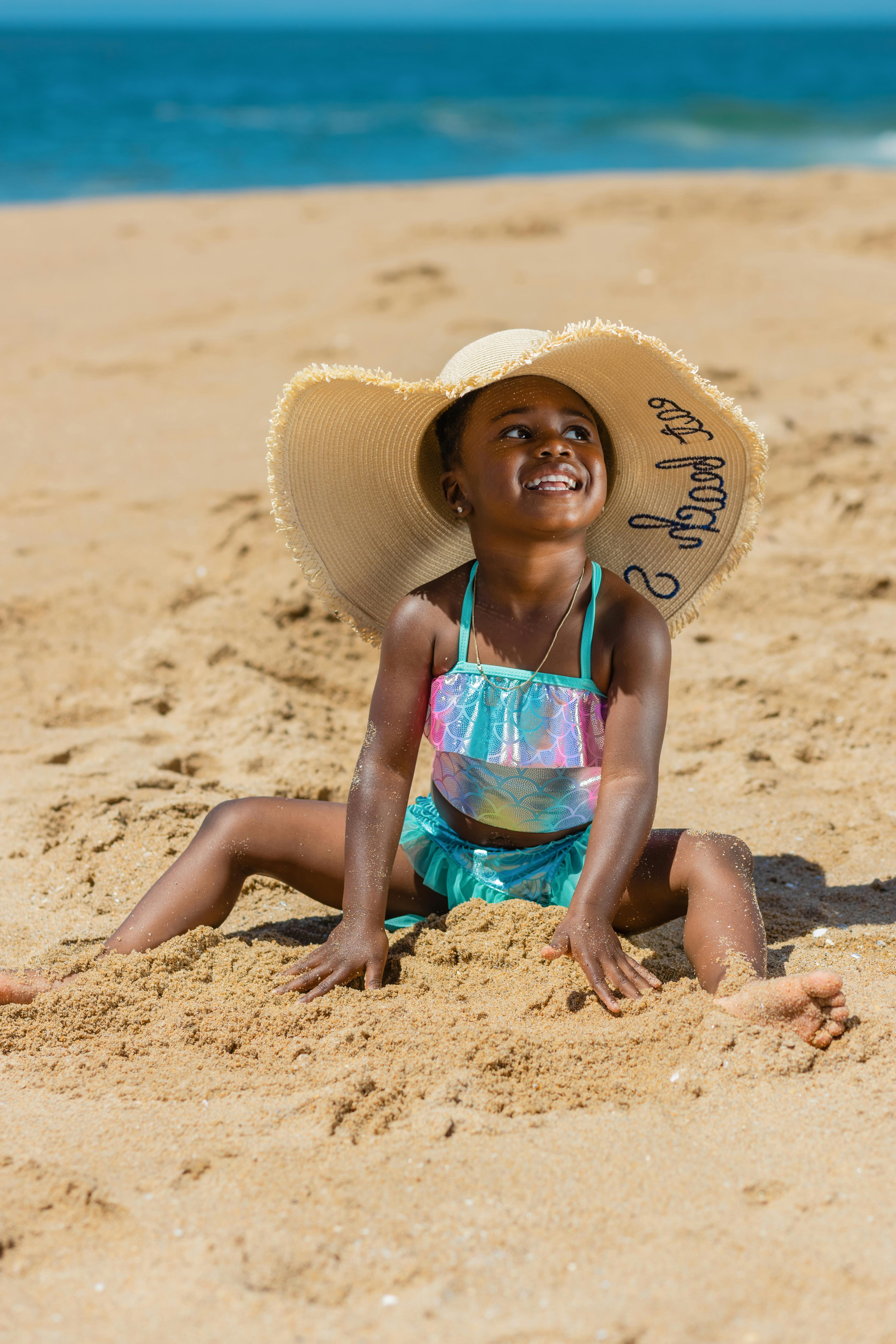 Little girl in sale bikini on beach