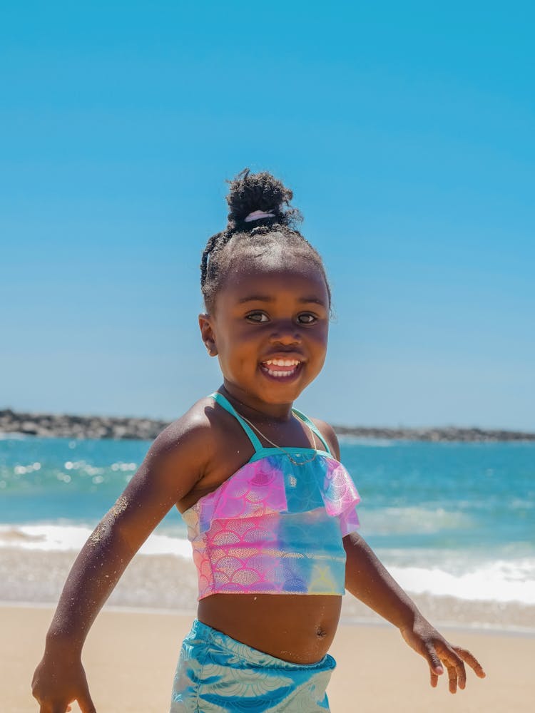 A Young Girl In Mermaid Style Swimsuit Smiling