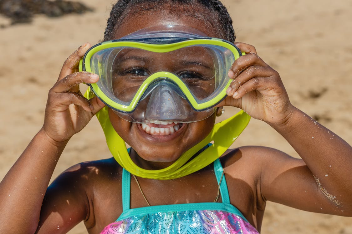 Free Selective Focus of a Little Girl Wearing Swimming Goggles Stock Photo