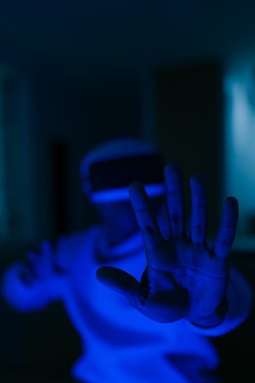 Persons Hand With Blue Light