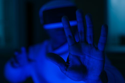 Persons Hand With Blue Light