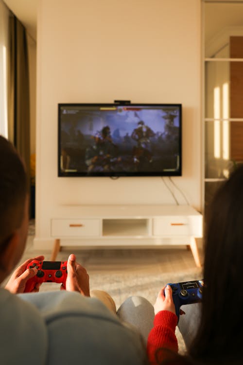 A Couple Playing Video Games in the Living Room