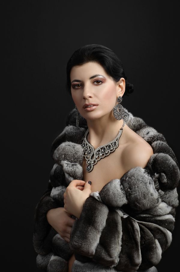 Woman in fur coat with dress