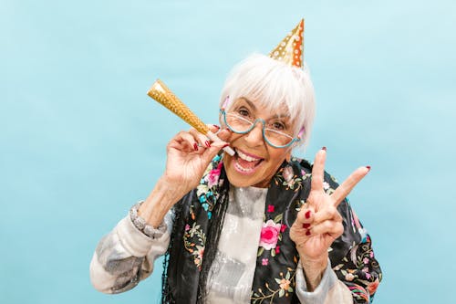 Free A Happy Elderly Woman Celebrating Her Birthday Stock Photo