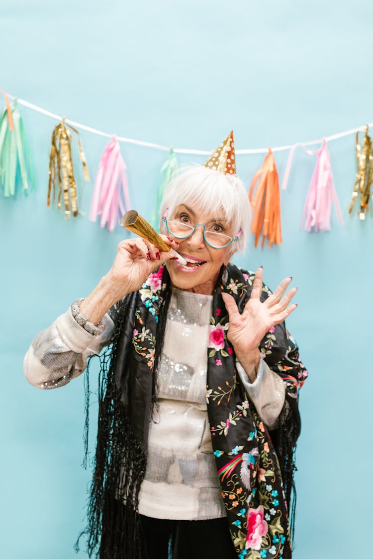 Elderly Woman With A Party Hat