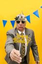 A Grumpy Man in Gray Suit Celebrating His Birthday