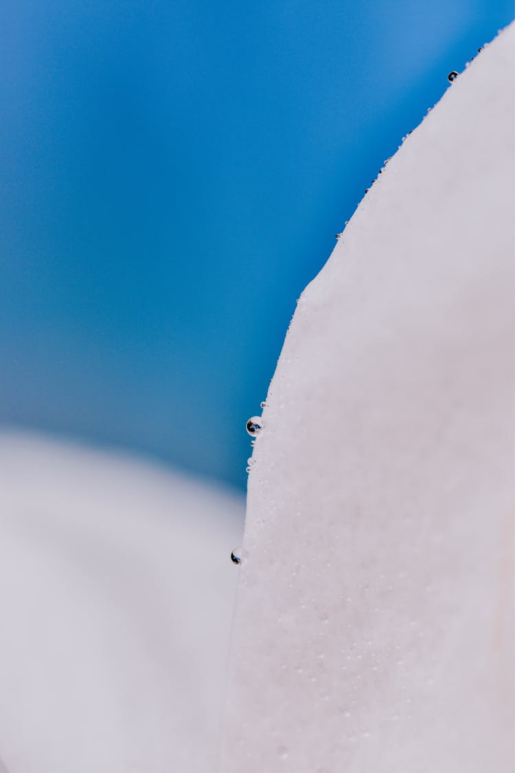 Water Droplets On White Surface