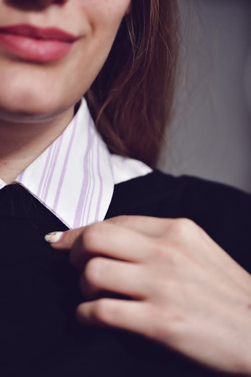 Close up of a Woman with Pink Lipstick and Striped Collar