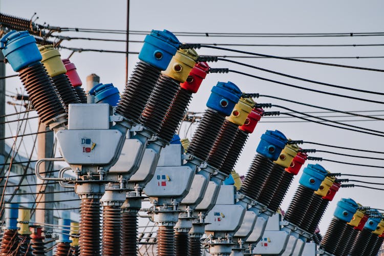 Close-up Of Electricity Poles And Transformers 