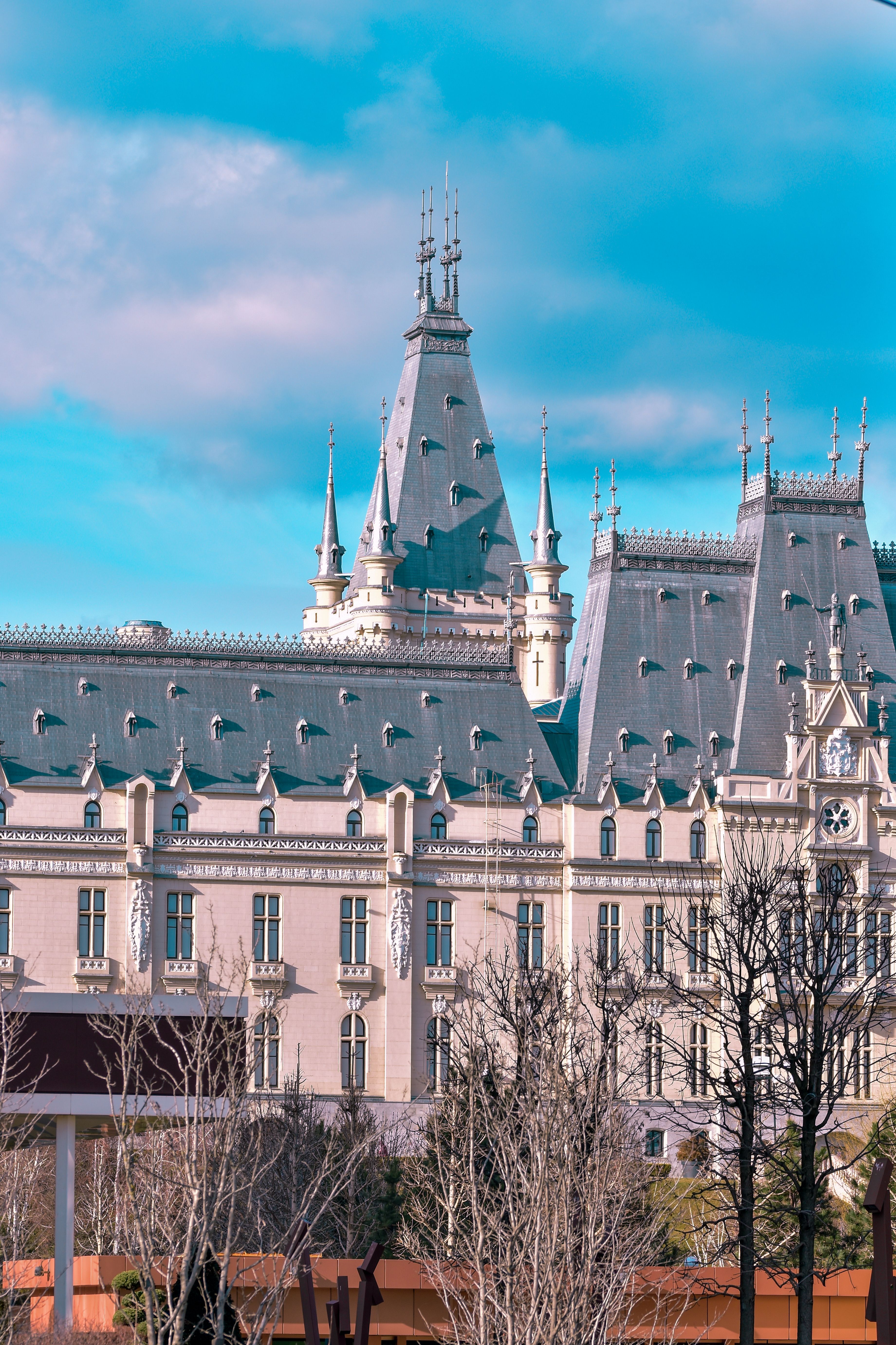 Decorative Building Facade with a Tower against Blue Sky · Free Stock Photo