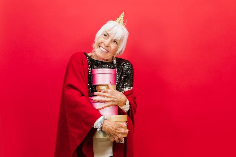 Elderly Woman Carrying Gifts