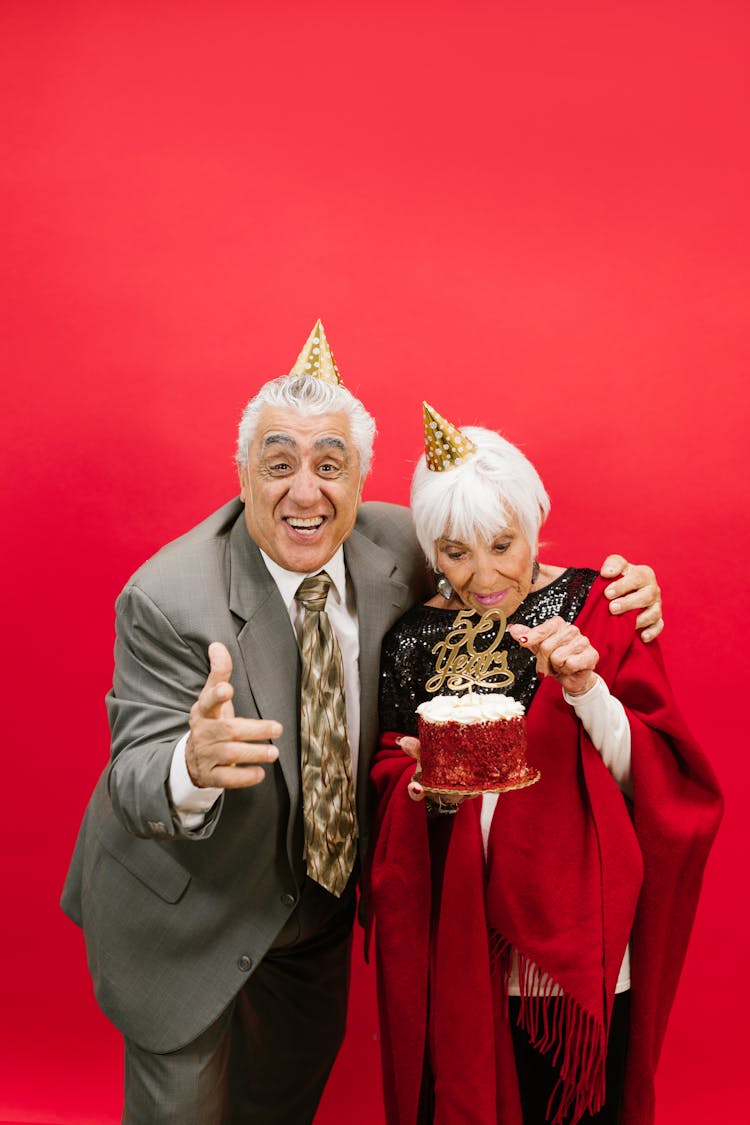 Happy Couple Wearing Party Hats