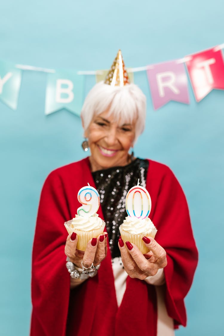 Woman Holding Cupcakes