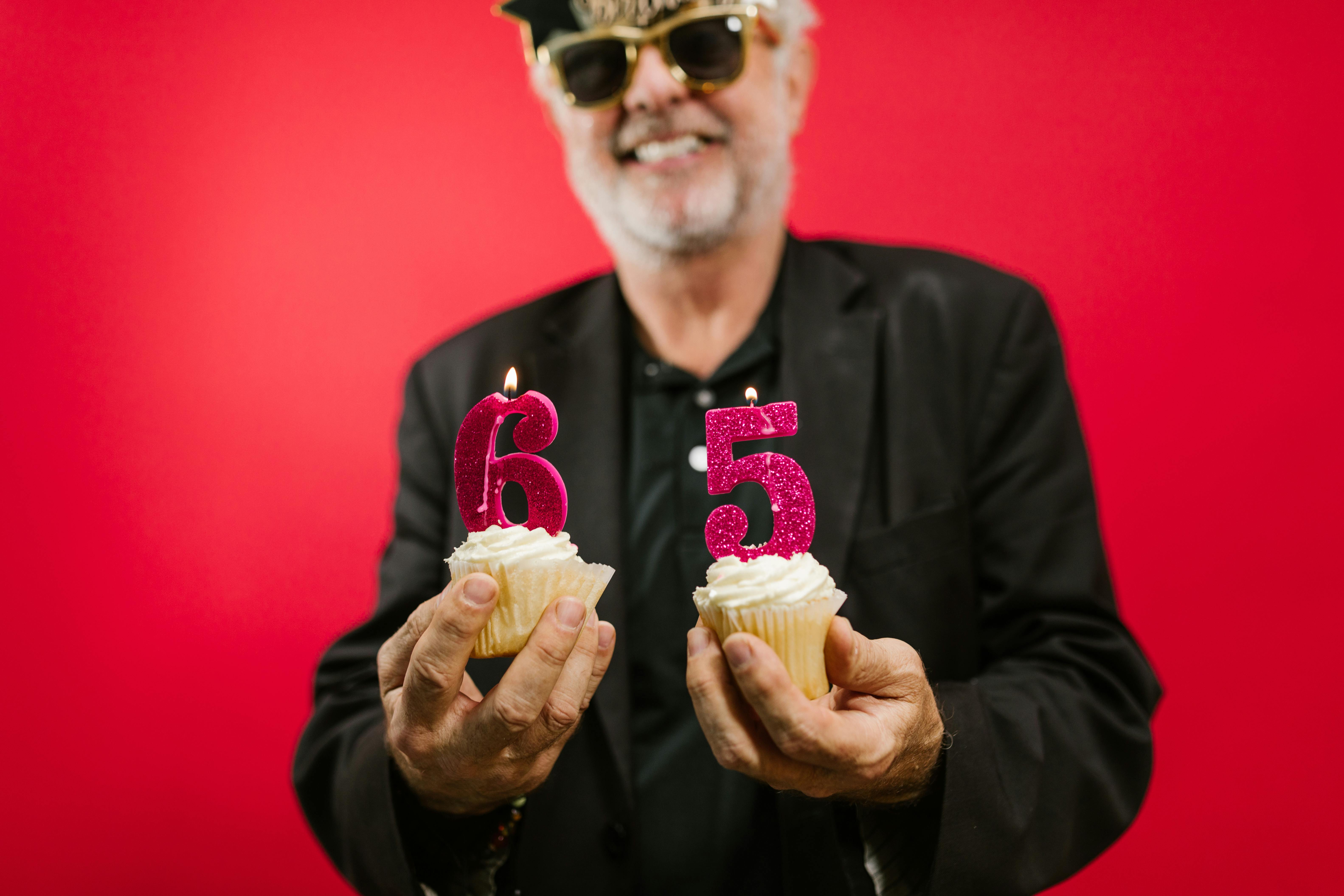 Man holding cupcakes with