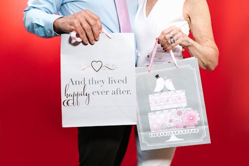 A Couple Holding Gift Bags