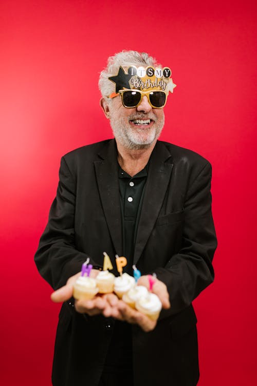 A Happy Elderly Man Wearing Decorative Sunglasses