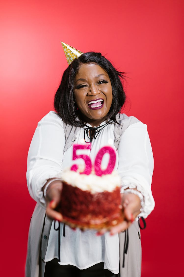 A Woman Holding Her Birthday Cake