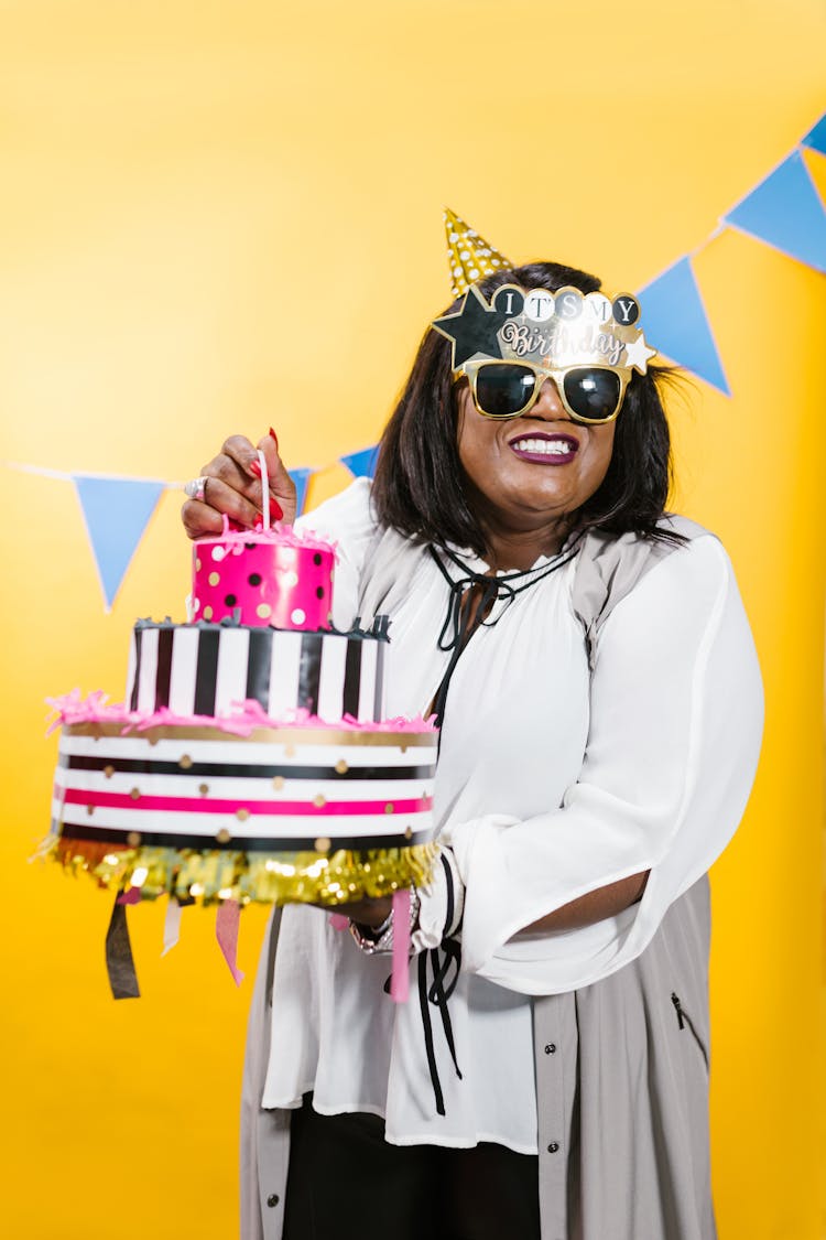 A Woman Holding Birthday Cake