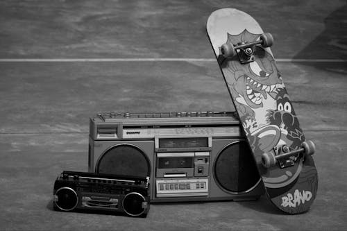 Skateboard Leaning on Cassette Player 