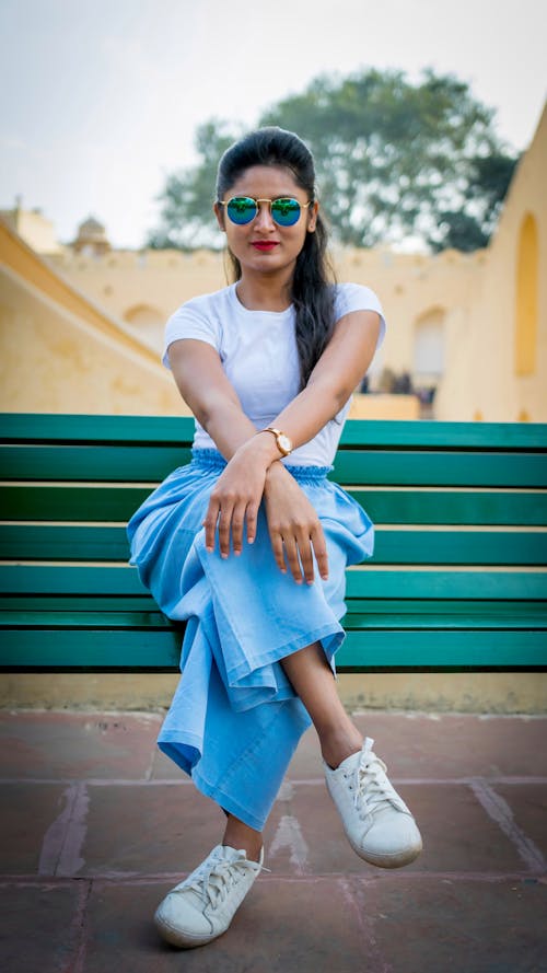 Pretty Woman Sitting on Bench