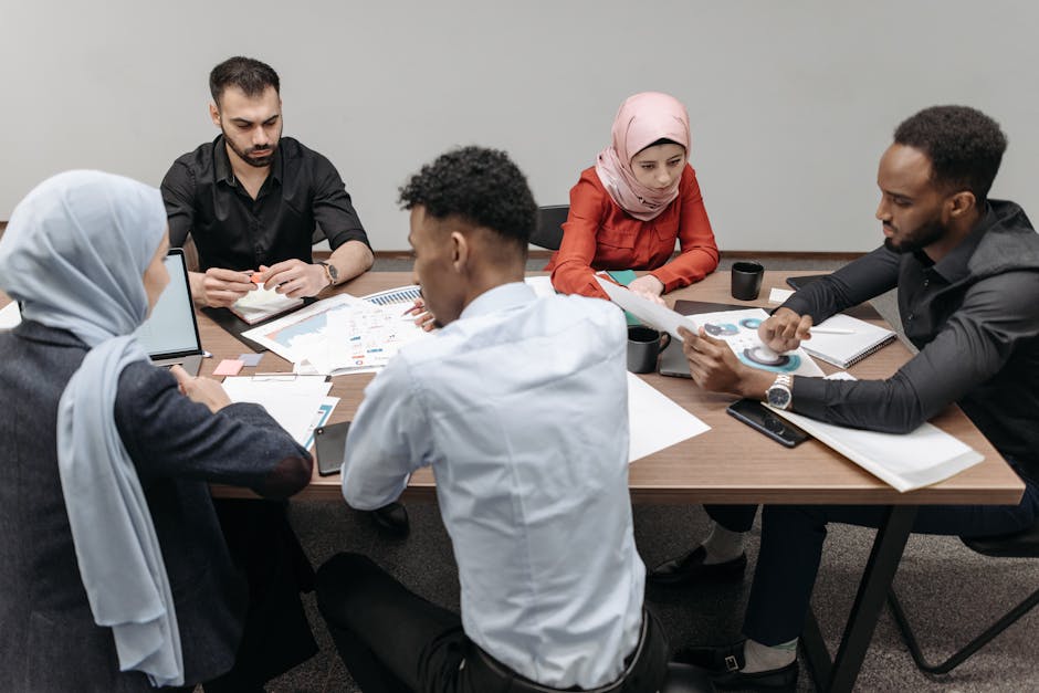 A diverse group of professionals collaborating on a global marketing project - culturally sensitive marketing