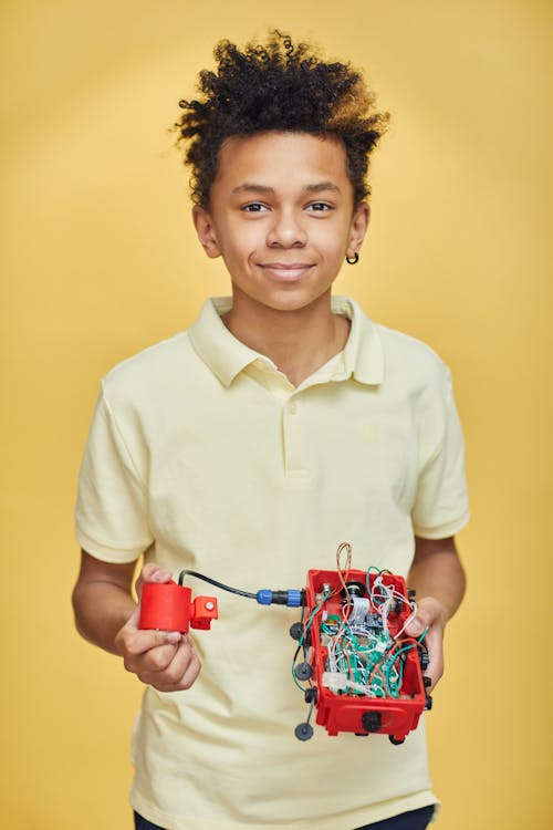 A Boy holding his Project