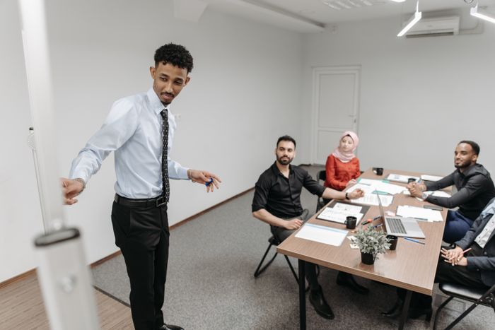 A founder speaking to the team in a meeting room — photo by Pavel Danilyuk on Pexels