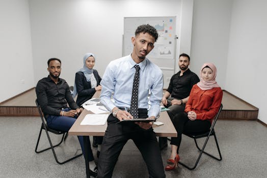A group of professionals having a corporate meeting in a modern office environment.