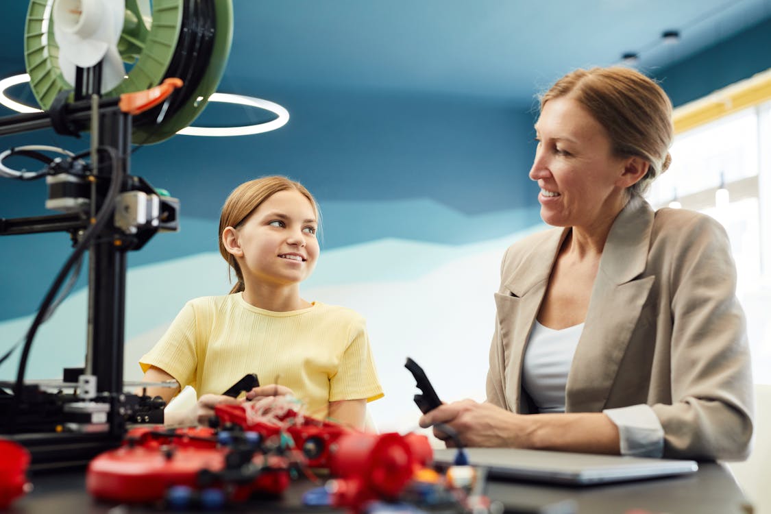 Smiling woman and girl working together