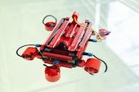 Red robot against white background