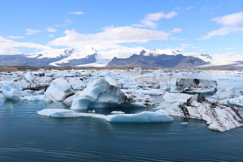 Free Frozen beauty of Iceland's glaciers with icebergs floating serenely. Stock Photo