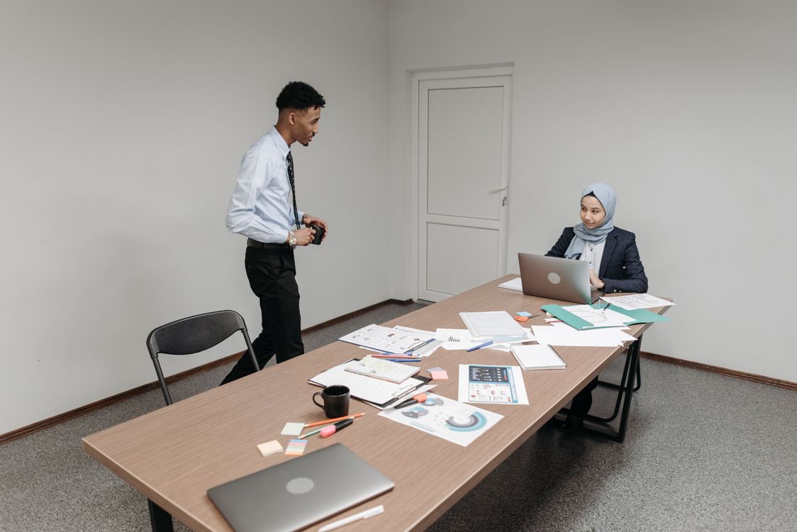 Employess Discussion Employees Discussing Inside the Meeting Room · Free Stock Photo