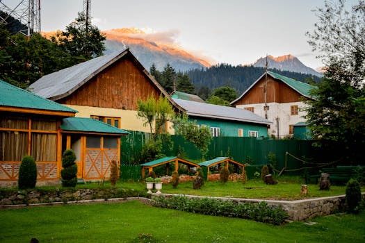 这座迷人的山间小屋拥有郁郁葱葱的花园，夏季可欣赏阳光明媚的山峰景色