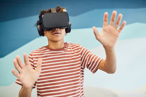 Amazed boy exploring virtual reality headset