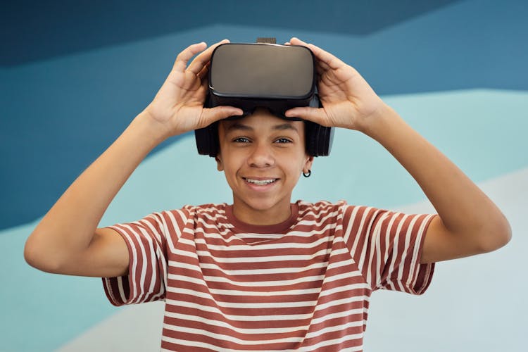 Smiling Boy Using VR Headset