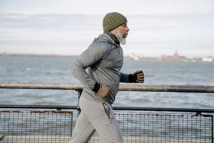 Old Black Man Running Near Water