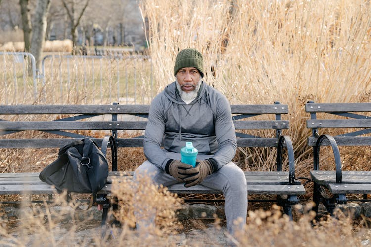 Senior African American Male Athlete Sitting In Park