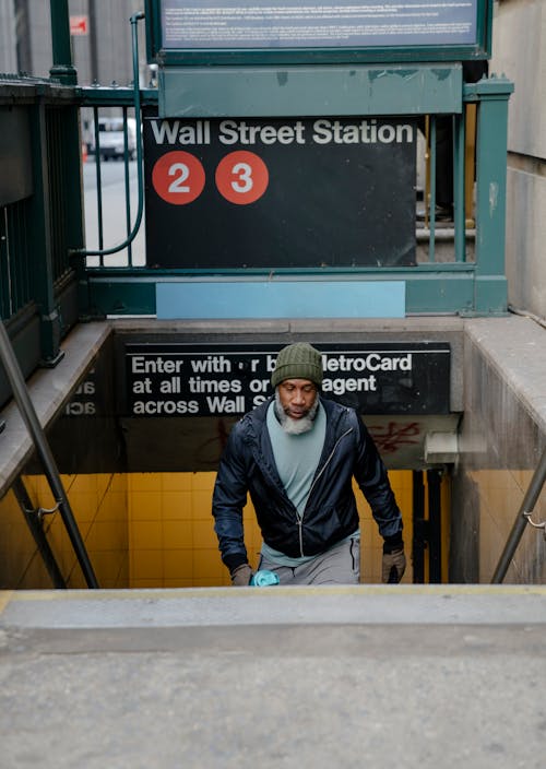 Free Black man going upstairs in subway station Stock Photo