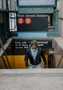 Black man going upstairs in subway station