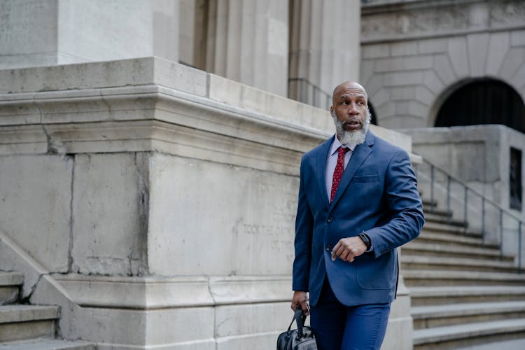 Confident Black Man Manager Walking On Street