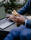 Person Holding Burger With Cheese