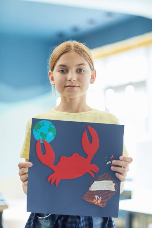 Free Young Girl Holding Her Art Project Stock Photo