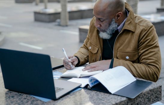 mature adult studying online technology career change